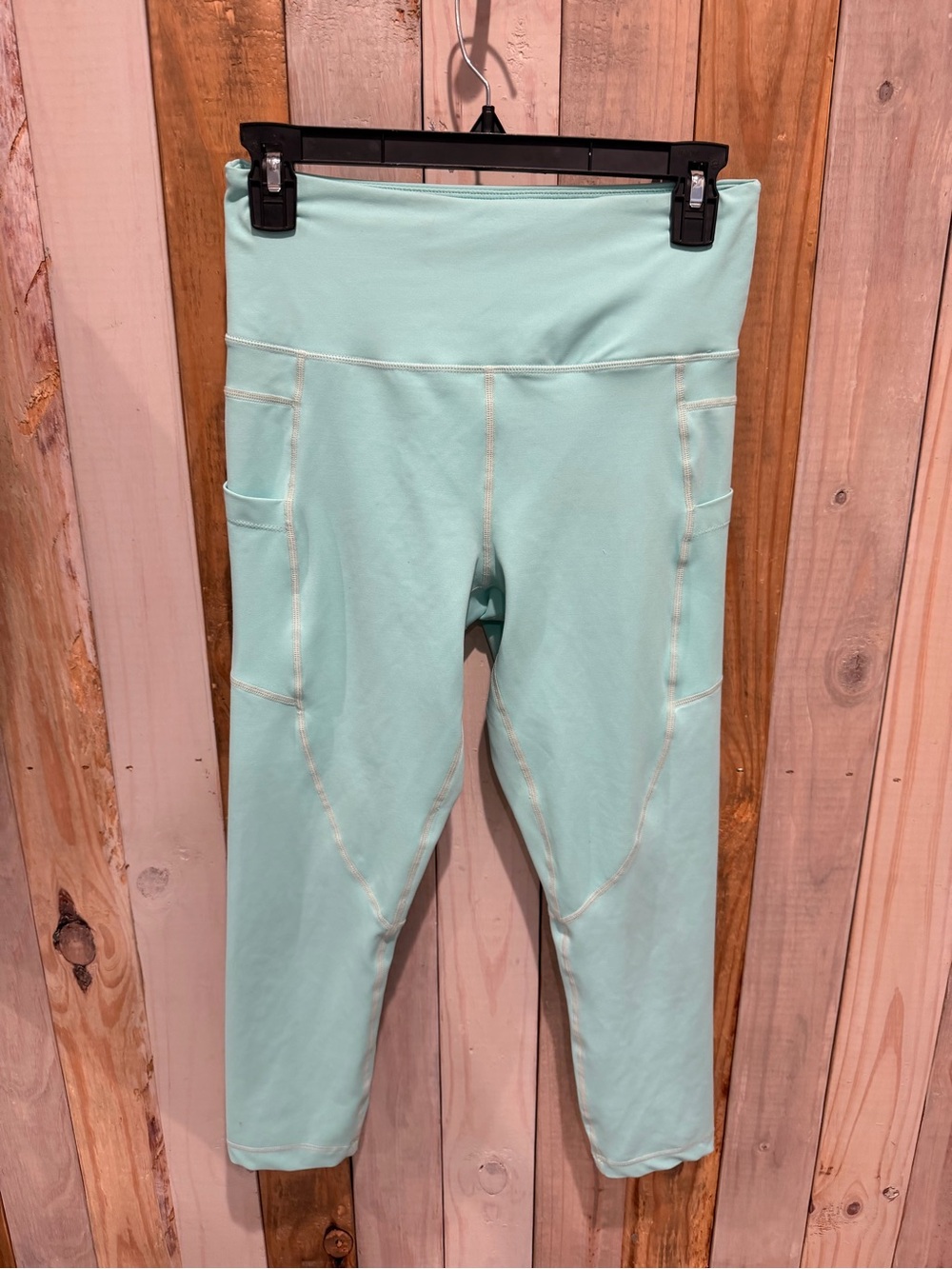 ZYIA Active high-rise cropped leggings in aqua green. Size M With Pockets
